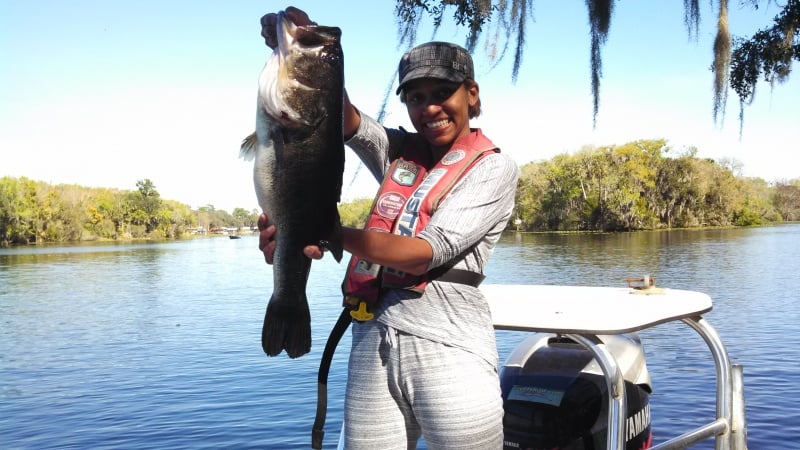 Black woman fishing for Mullet on the St.Johns River in Central