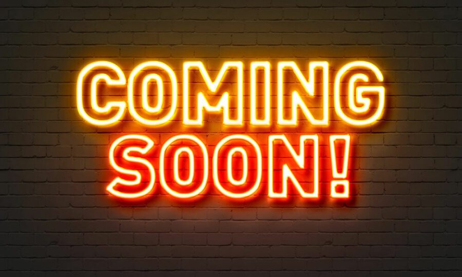 Coming soon neon sign on brick wall background. Texas Coming Soon