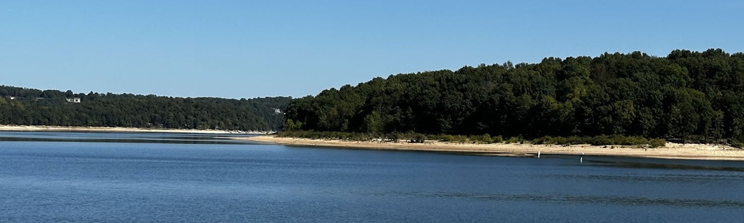 Beaver Lake Arkansas A scenic view of Beaver Lake with a Beaver dam in the background
