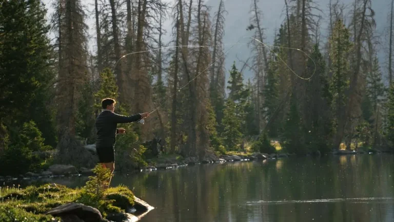 9 Essential Fall Bass Fishing Strategies for Success 25 Fall bass fishing strategies at a serene alpine lake in Utah at dawn.